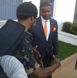 Denis Maina (left) exchanges greetings with WTV Corporate Director Johnson Mwakazi after the band performed at the Cambridge International School, Karen.