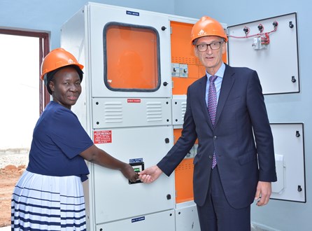 Kenya Power Deputy Business Development Manager Eng. Emelda Odhiambo and Nick Langford, Kenya Country Head for Rendeavour, Tatu City's owner and developer, switch on a transformer at Tatu City. Kenya Power and Tatu City have signed a partnership to deliver power to Tatu City's residents and businesses.